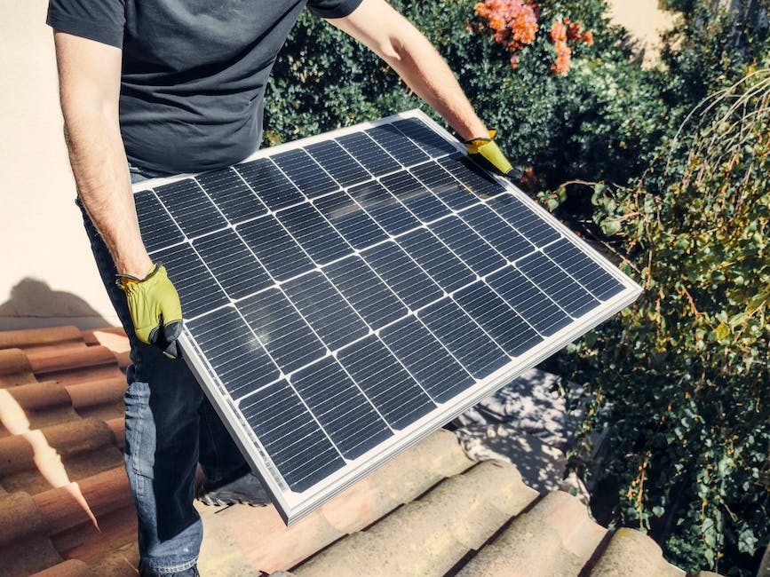 A researcher holding a solar panel with a green energy symbol in the background
